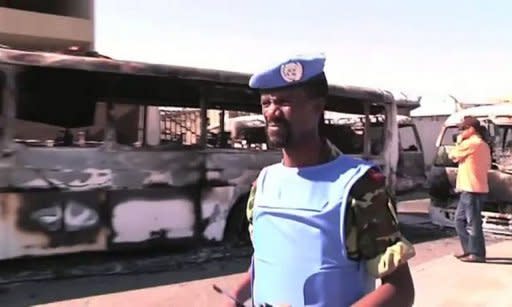 An image from a UN Supervision Mission in Syria video shows UN observers on Saturday inspecting a power transfer station in the Qabun district of Damascus after an explosion. The new head of Syria's main opposition group called Sunday for mass defections from a Syrian regime struggling to survive by carrying out massacres, as the death toll in the uprising topped 14,000