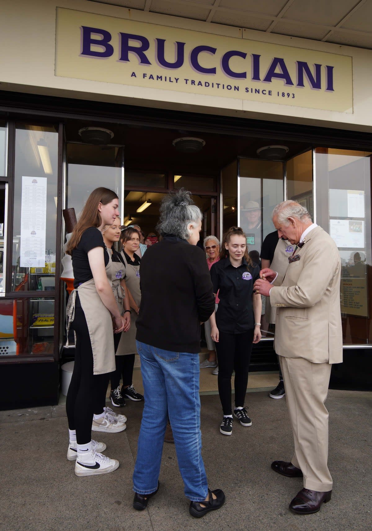 The Prince of Wales receives an ice cream after a visit to the Winter Gardens in Morecambe, Lancashire (Peter Byrne/PA) (PA Wire)