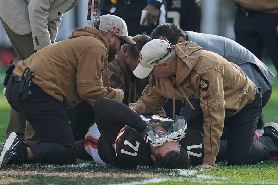 Cleveland Browns offensive tackle Jedrick Wills Jr. (71) reacts while being tended to after an injury against the Arizona Cardinals on Sunday in Cleveland.