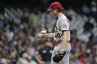 St. Louis Cardinals' Jake Woodford uses a rosin bag during the fifth inning of a baseball game against the Milwaukee Brewers Tuesday, Sept. 21, 2021, in Milwaukee. (AP Photo/Aaron Gash)