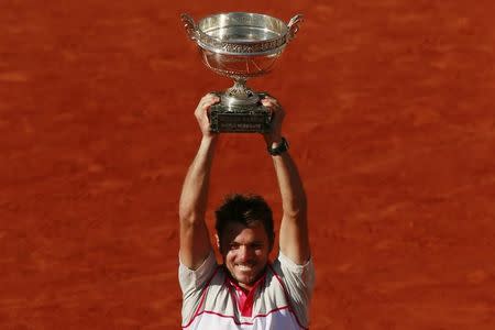 Tennis - French Open - Roland Garros, Paris, France - 7/6/15 Men's Singles - Switzerland's Stanislas Wawrinka celebrates with the trophy after winning the final Action Images via Reuters / Jason Cairnduff Livepic