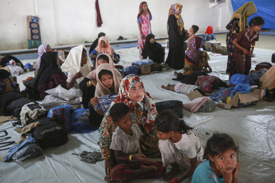 Ethnic Rohingya people take shelter in the basement of a building in Banda Aceh, Aceh province, Indonesia, Thursday, Dec. 21, 2023. Indonesian authorities detected at least five boats packed tight with refugees approaching shores of Aceh province, the latest in a surge of vessels that have arrived in Aceh, most carrying Rohingya refugees from southern Bangladesh, where the persecuted Muslim minority fled in 2017 following attacks by the military in their homeland of Myanmar. (AP Photo/Reza Saifullah)