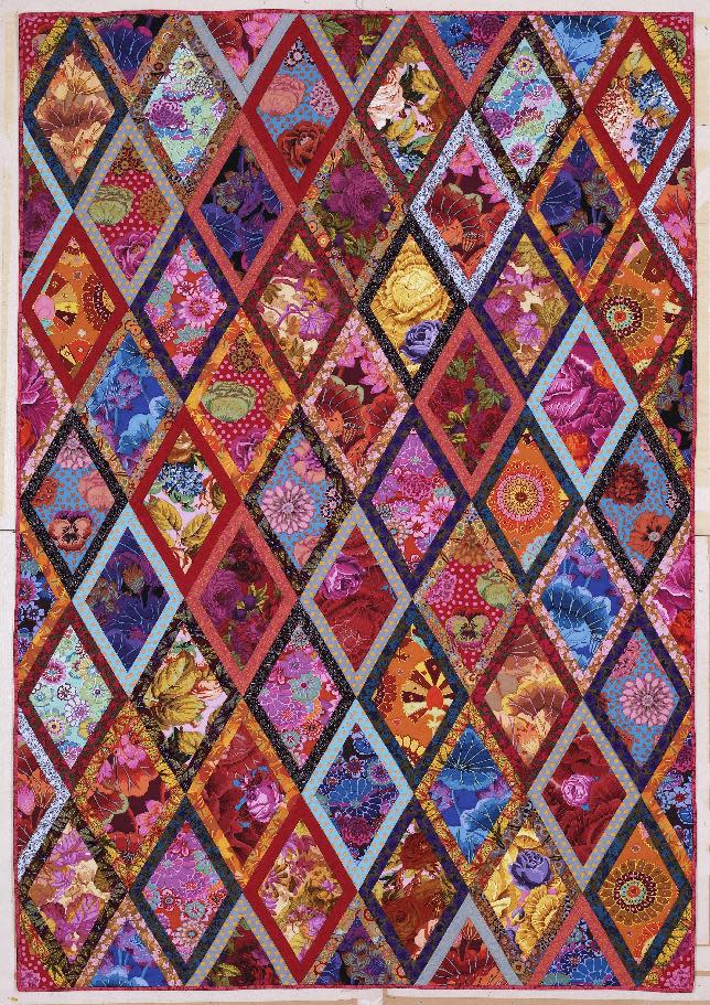 This publicity photo provided by Abrams shows The Bordered Diamonds quilt from Kaffe Fassett's book "Simple Shapes Spectacular Quilts" (STC Craft/A Melanie Falick Book, 2010) and it also appears in his autobiography, "Kaffe Fassett: Dreaming in Color" (2012). He's taught workshops on this quilt throughout the world. (AP Photo/Abrams, Jon Stewart)