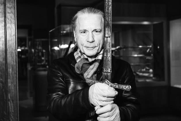 Bruce Dickinson holds a 400-year old sword in the Arms and Armor wing of the Metropolitan Museum of Art in New York, January 2024. - Credit: Photographs by Griffin Lotz