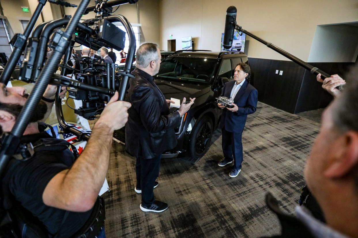 Steven Center, chief operating officer and executive vice president for KIA America is interviewed in front of the KIA EV9 that was named the 2024 North American Utility of the Year at M1 Concourse in Pontiac, Mich., on Thursday, Jan. 4, 2024.