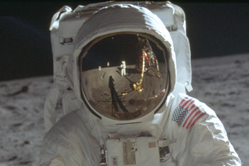 This detail of a July 20, 1969 photo made available by NASA shows astronaut Neil Armstrong reflected in the helmet visor of Buzz Aldrin on the surface of the moon. The astronauts had a camera mounted to the front of their suits, according to the Universities Space Research Association. So rather than holding the camera up to his eye, as we’re accustomed to, Armstrong would have taken the photos from near his chest, which is where Armstrong’s hands appear to be in his reflection. (Neil Armstrong/NASA via AP)
