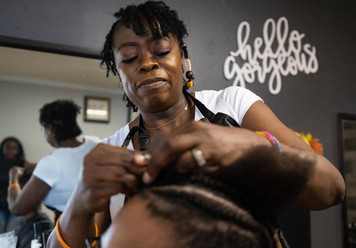 Comfort Corder braids Royce Jackson’s hair Monday, Sept. 12, 2022, at Coco’s Braiding & Styling Salon in Arlington. The salon was voted to second-place finalist in the Star-Telegram Readers’ Choice poll for best hair salon in the Fort Worth area.