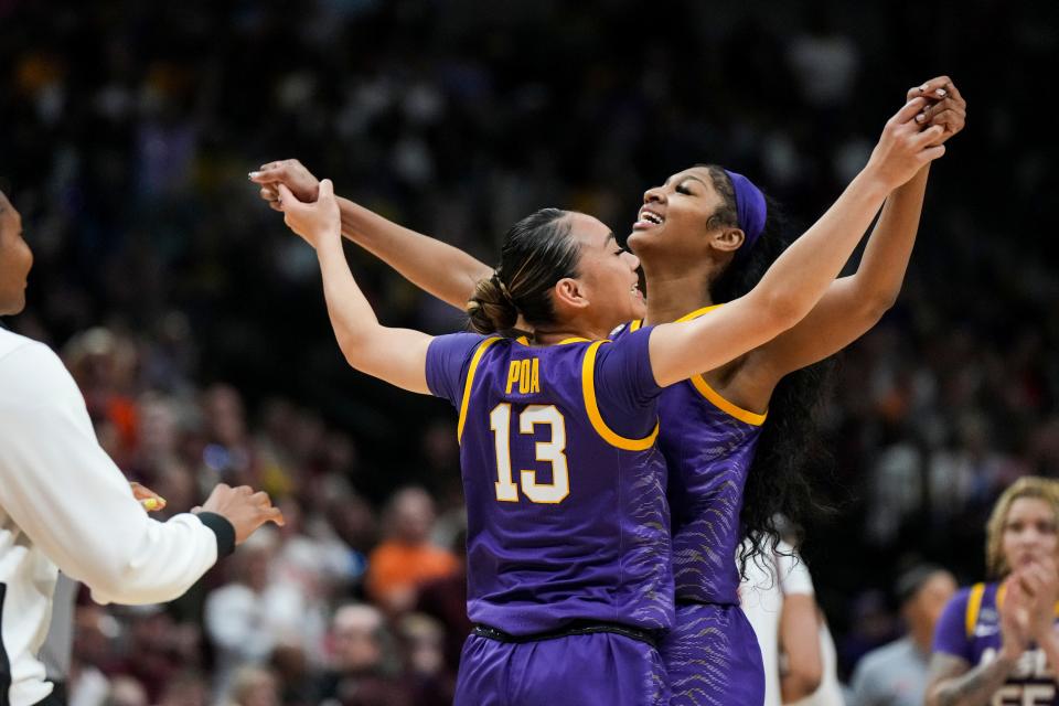 LSU guard Last-Tear Poa (13) celebrates with forward Angel Reese during Friday's game vs. Virginia Tech.