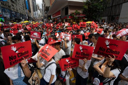 <span class="caption">Protests have been banned at the 25th anniversary of the Hong Kong handover ceremony.</span> <span class="attribution"><span class="source">John Ye/Shutterstock</span></span>