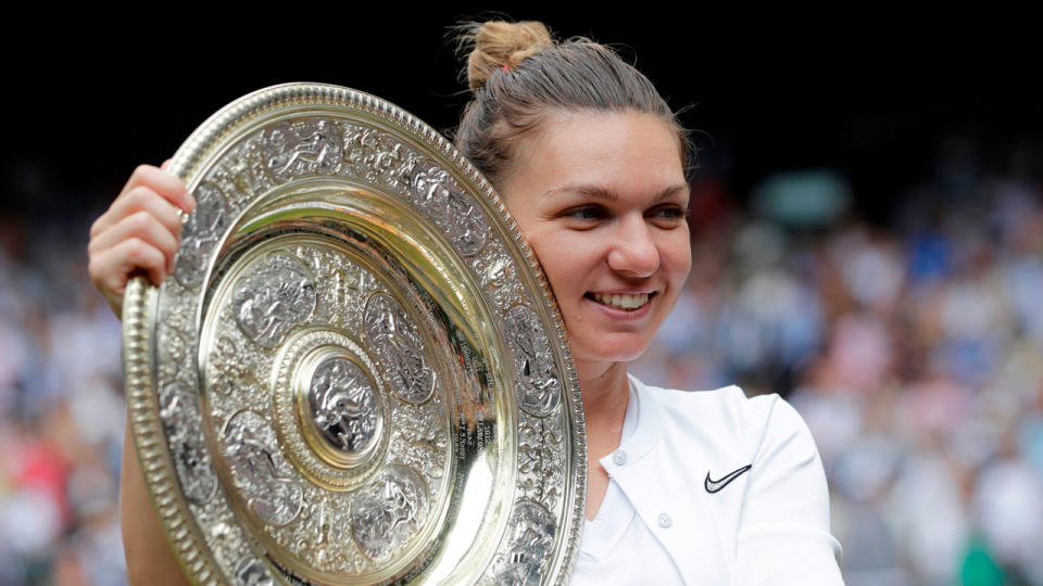 Simona Halep holds aloft the Venus Rosewater Dish after winning Wimbledon. Pic: Getty