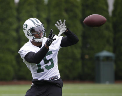 New York Jets' Brandon Marshall catches a pass during an NFL football organized team activity in Florham Park, N.J., Wednesday, May 27, 2015. (AP Photo/Seth Wenig)