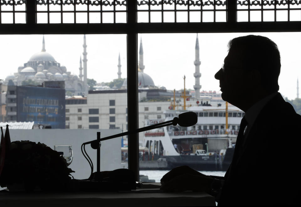 Ekrem Imamoglu, the new Mayor of Istanbul from Turkey's main opposition opposition Republican People's Party (CHP) talks to members of foreign media a day after he took over office, in Istanbul, Friday, June 28, 2019. Imamoglu said Friday he was prepared against any attempts by the government to restrict his powers while emphasizing his willingness to work with Turkish President Recep Tayyip Erdogan.(AP Photo/Lefteris Pitarakis)