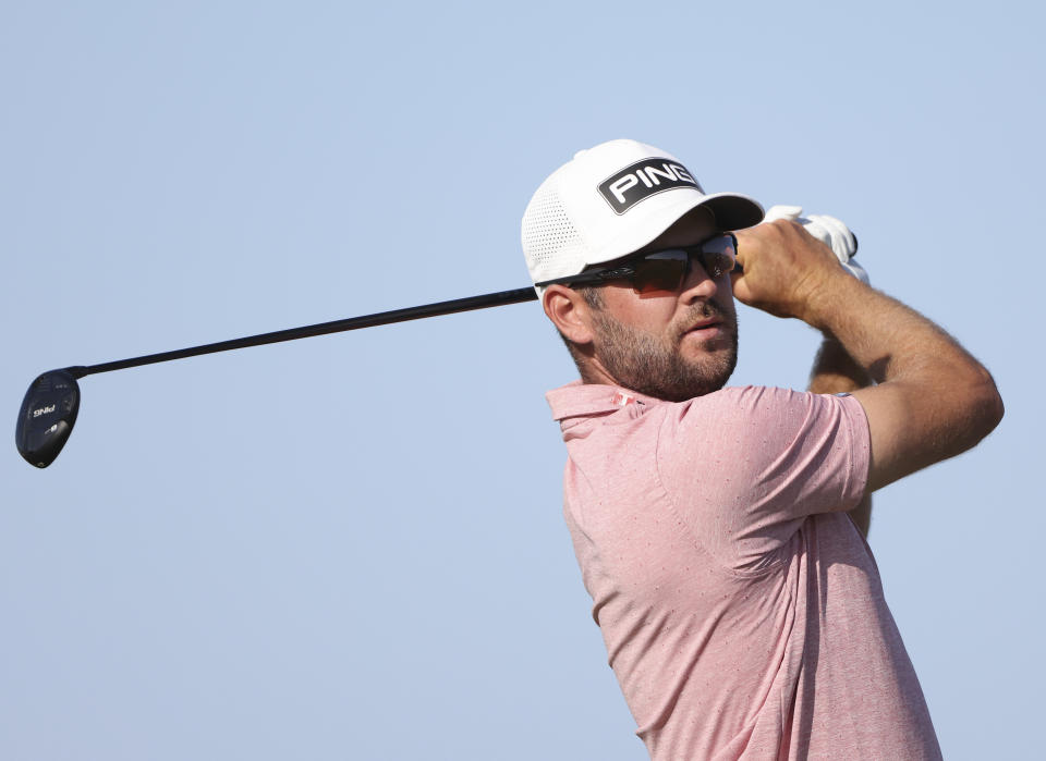 Canada's Corey Conners play his tee shot on the 17th hole during the third round of the British Open Golf Championship at Royal St George's golf course Sandwich, England, Saturday, July 17, 2021. (AP Photo/Ian Walton)