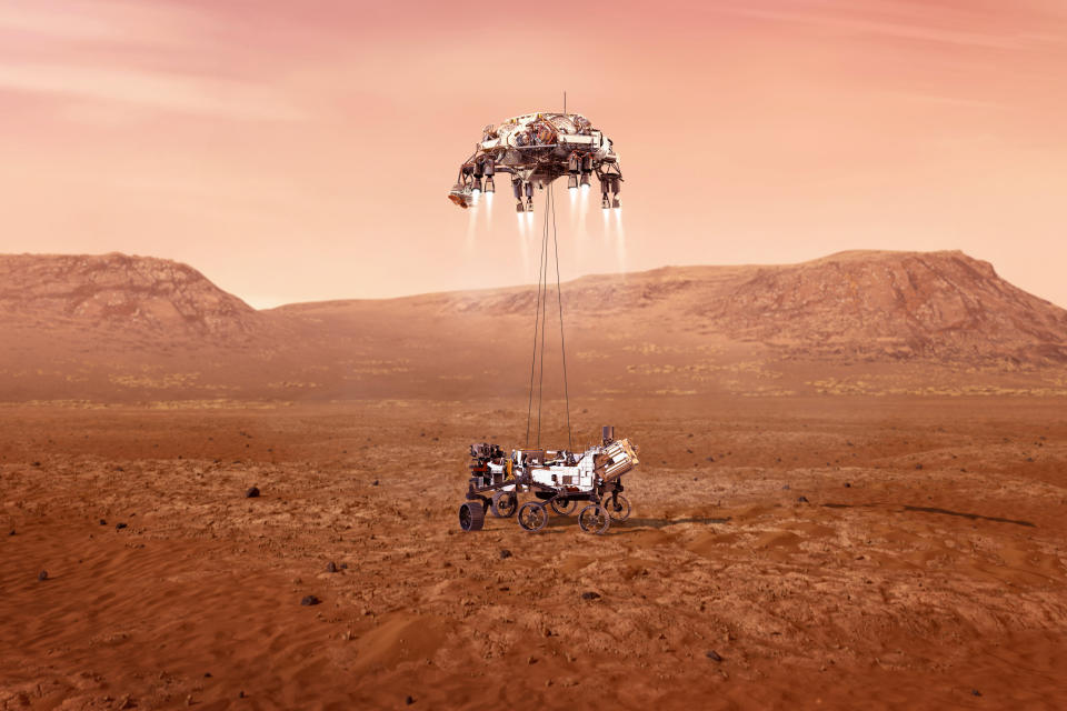 This illustration provided by NASA shows the Perseverance rover, bottom, landing on Mars. Hundreds of critical events must execute perfectly and exactly on time for the rover to land safely on Feb. 18, 2021. Entry, Descent, and Landing, or "EDL," begins when the spacecraft reaches the top of the Martian atmosphere, traveling nearly 12,500 mph (20,000 kph). EDL ends about seven minutes after atmospheric entry, with Perseverance stationary on the Martian surface. (NASA/JPL-Caltech via AP)