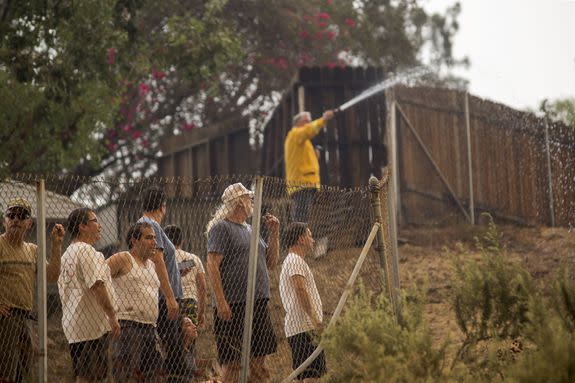 Residents in the Sunland-Tujunga area watch nearby growing flames on September 2, 2017.  People had been evacuated from hundreds of homes in Sunland-Tujunga, Burbank, and Glendale.