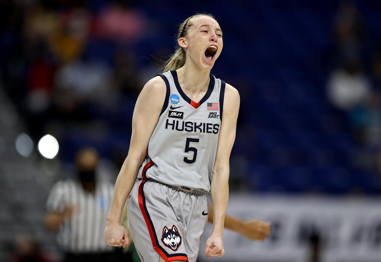 SAN ANTONIO, TEXAS - MARCH 29: Paige Bueckers #5 of the UConn Huskies celebrates her three point basket in the first quarter against the Baylor Lady Bears during the Elite Eight round of the NCAA Women's Basketball Tournament at the Alamodome on March 29, 2021 in San Antonio, Texas. (Photo by Elsa/Getty Images)