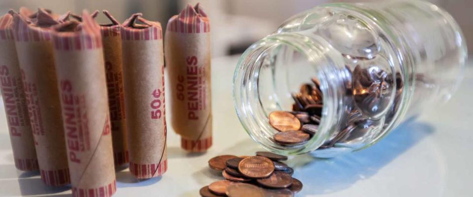 American coins in loose change and in paper rolls prepared for currency exchange at the bank.