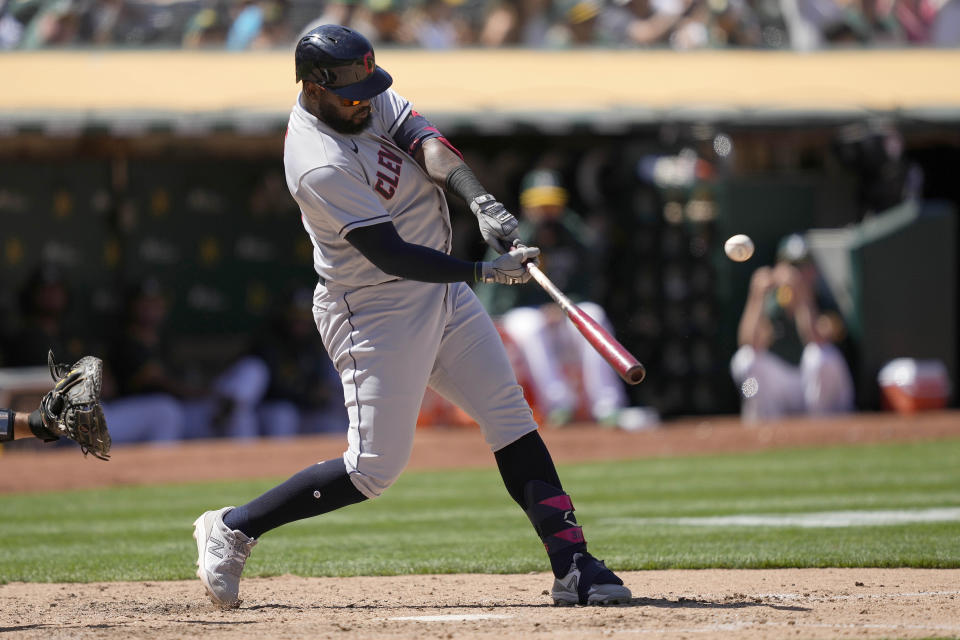 Cleveland Indians' Franmil Reyes hits a solo home run against the Oakland Athletics during the eighth inning of a baseball game Saturday, July 17, 2021, in Oakland, Calif. (AP Photo/Tony Avelar)