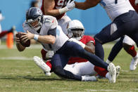 Tennessee Titans quarterback Ryan Tannehill (17) is sacked by Arizona Cardinals defensive end Michael Dogbe in the second half of an NFL football game Sunday, Sept. 12, 2021, in Nashville, Tenn. (AP Photo/Wade Payne)