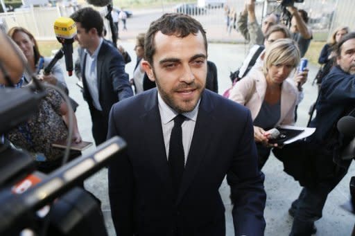 Aurelien Hamelle (C), French lawyer of Prince William and Catherine, answers journalists' questions at the courthouse in Nanterre, near Paris. The lawyer has drawn a parallel with the "fatal hunt" by paparazzi that led to the death of William's mother Princess Diana