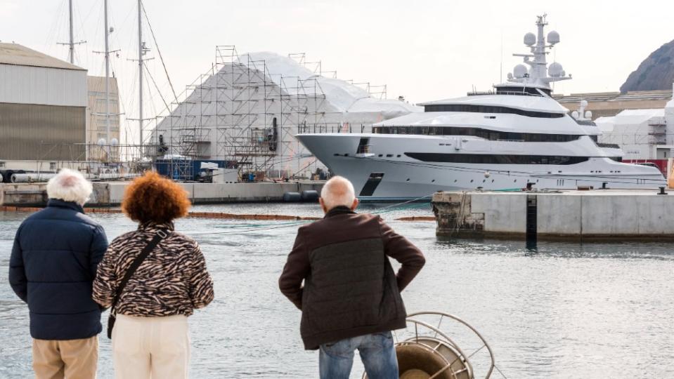 Town residents in La Ciotat, France, look at the impounded Amore Vera, owned by Rosneft CEO Igor Sechin. - Credit: Courtesy AP