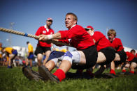 Team Switzerland compete in the 560 kg weight category during the Tug of War World Championships in the town of Appenzell, some 90 km (56 miles) east of Zurich September 8, 2012. The origin of tug of war is in ancient rituals and ceremonies, where the fight between the good and the bad was symbolized and later it developed into a sporting competition. REUTERS/Michael Buholzer (SWITZERLAND - Tags: SPORT SOCIETY)