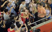 <p>United States’ Ashton Eaton embraces his wife Canada’s Brianne Theisen Eaton after winning the gold medal in the decathlon at the World Athletic Championships at the Bird’s Nest stadium in Beijing, Saturday, Aug. 29, 2015. (AP Photo/Wong Maye-E) </p>