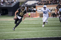 Wake Forest quarterback Sam Hartman (10) rushes for a touchdown during the first half of an NCAA college football game against Duke on Saturday, Oct. 30, 2021, in Winston-Salem, N.C. (AP Photo/Matt Kelley)