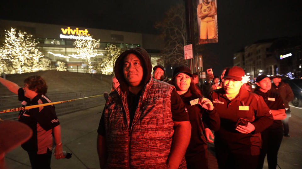 People leave Vivint Smart Home Arena after the Utah Jazz's NBA basketball game against the Golden State Warriors on Friday, Nov. 22, 2019, in Salt Lake City. Most fans had already left the building when players, coaches and reporters were instructed to leave after a suspicious package was found following Utah's 113-109 victory over the Warriors. (AP Photo/Rick Bowmer)