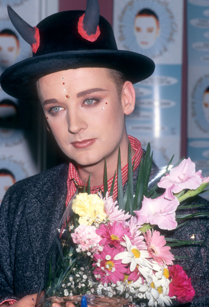 closeup of george holding flowers