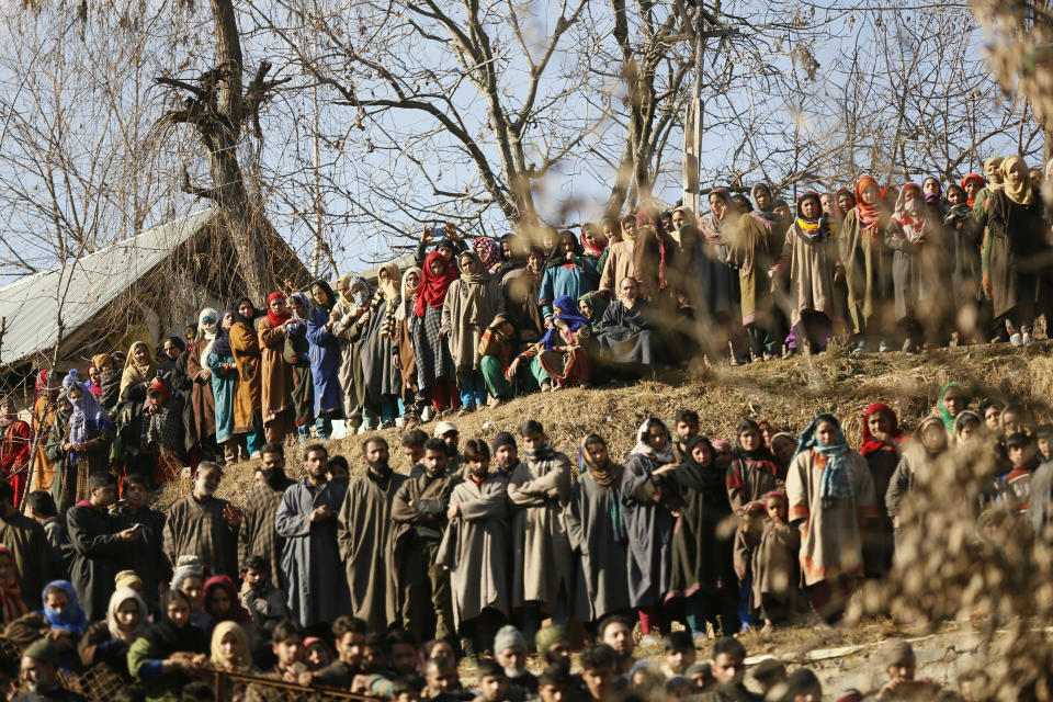 Kashmiri villagers attend the funeral of rebel commander Zeenatul Islam in Sugan village 61 kilometers (38 miles) south of Srinagar, Indian controlled Kashmir, Sunday, Jan. 13, 2019. Massive anti-India protests and clashes erupted in disputed Kashmir on Sunday, leading to injuries to at least 16 people after a gunbattle between militants and government forces overnight killed two rebels, police and residents said. (AP Photo/Mukhtar Khan)