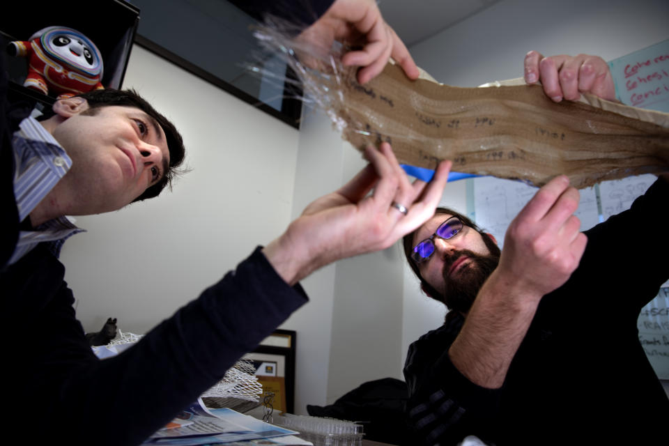 Chemical Engineering Professor Max Stein and Brian Iezzi, Post-doctoral Researcher at Materials Science and Engineering Department analyze the fabric with photonic fibers woven into it at the University of Michigan’s North Campus Research Center in Ann Arbor, MI. 

Less than 15% of the 92 million tons of clothing and other textiles discarded annually are recycled—in part because they are so difficult to sort. Woven-in labels made with inexpensive photonic fibers developed by a University of Michigan-led team could change that.

Ordinary tags often don't make it to the end of a garment's life—they may be cut away or washed until illegible, and tagless information can wear off. Recycling could be more effective if a tag was woven into the clothing, invisible until it needs to be read. This is what the new fiber developed by Shtein's team could do. It harnesses the optical effects that enable the shimmering brilliance of butterfly wings, potentially being totally discreet in the optical spectrum yet easily read by automated recycling sorters.  

Wednesday, January 18, 2023
 
Photo by Marcin Szczepanski/Lead Multimedia Storyteller, University of Michigan College of Engineering