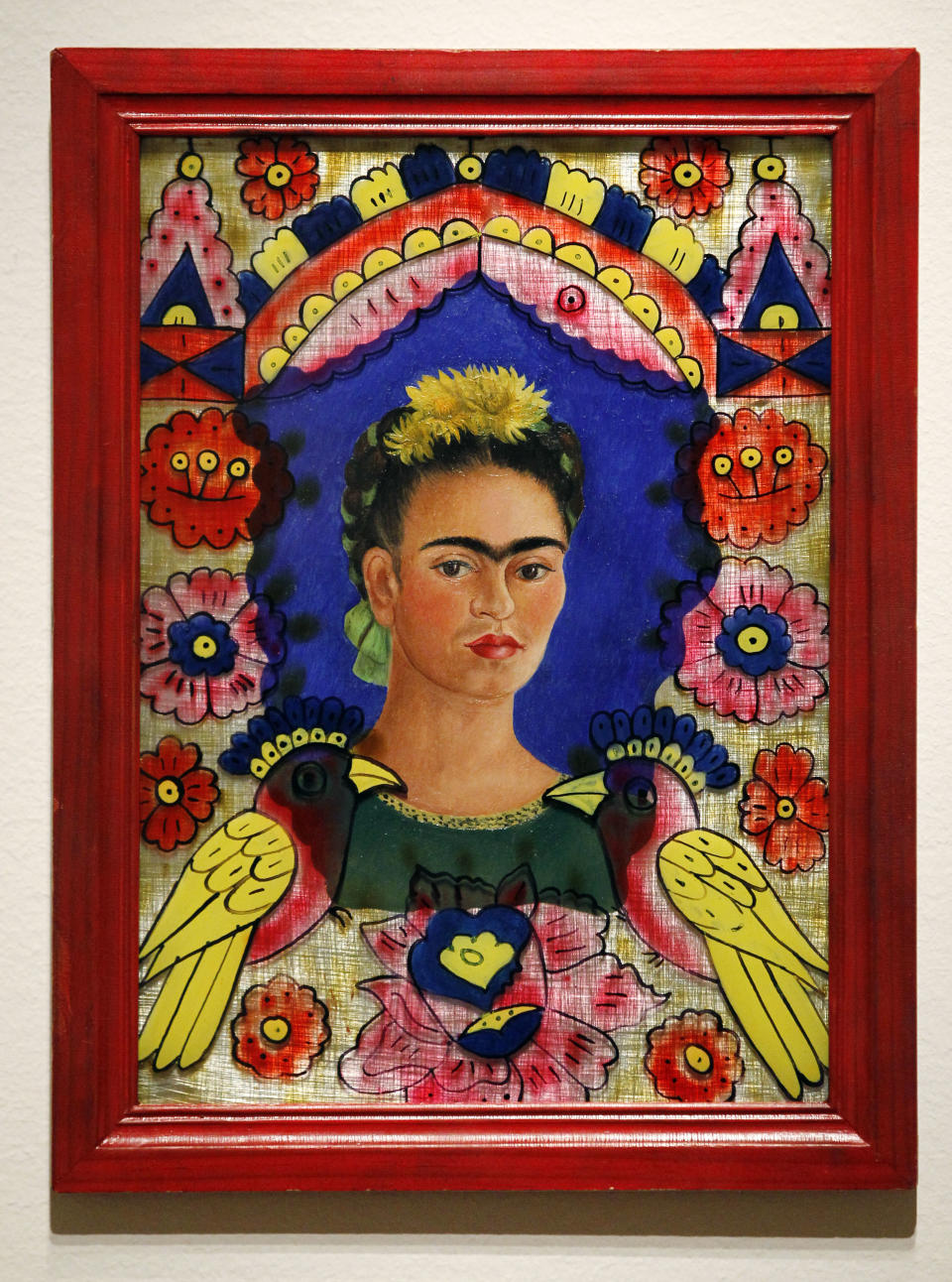 In this photo taken Tuesday, Oct. 9, 2012, a painting by Frida Kahlo (The Frame, 1938) is seen as part of one of two new exhibits featuring art exclusively by women at the Seattle Art Museum, in Seattle. Included in the exhibition is the only U.S. stop for an exhibit from the Pompidou Center in Paris, home of the modern art museum there, of painting, sculpture, drawing, photography and video. The exhibit runs through Jan. 13, 2013. (AP Photo/Elaine Thompson)