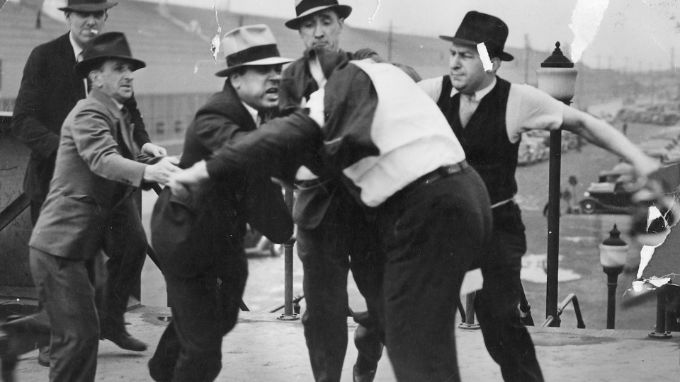 Ford Motor Company security men beat Richard Frankensteen, a UAW organizer, during the Battle of the Overpass in 1937 at the Rouge plant in Dearborn.