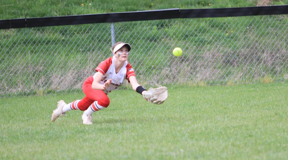 Johnstown sophomore left fielder Peyton Mischel dives for a fly ball against Lakewood on Friday, April 21, 2023. The host Johnnies led 3-0 in the fourth inning when a storm suspended play.