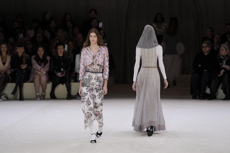 Models wear creations for Chanel as part of the Haute Couture Spring-Summer 2024 collection presented in Paris, Tuesday, Jan. 23, 2024. (AP Photo/Thibault Camus)