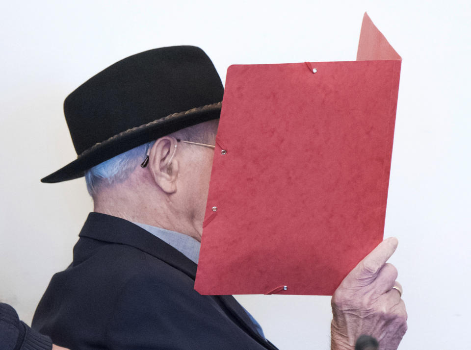 93-year-old former SS guard Bruno Dey in the concentration camp Stutthof near Danzig is sitting in the regional court in Hamburg, Germany, Oct.17, 2019. The prosecution accuses the 93-year-old man of aiding and abetting the murder of 5230 people. The defendant was only 17 or 18 years old at the time of the crime. That's why the trial takes place in front of a juvenile delinquency chamber. About 25 survivors of the concentration camp appear as joint plaintiffs. (Daniel Bockwoldt/dpa via AP)