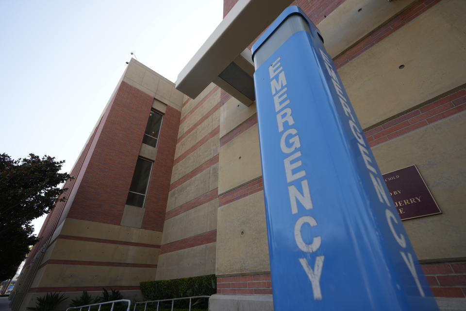 An emergency calling post is seen outside the Galen Center on Tuesday, July 25, 2023, in Los Angeles. Bronny James, son of NBA superstar LeBron James, is hospitalized in stable condition a day after going into cardiac arrest while participating in a basketball practice at the University of Southern California. A family spokesman said USC medical staff treated the 18-year-old James on Monday at Galen Center and he was transported to a hospital. (AP Photo/Damian Dovarganes)