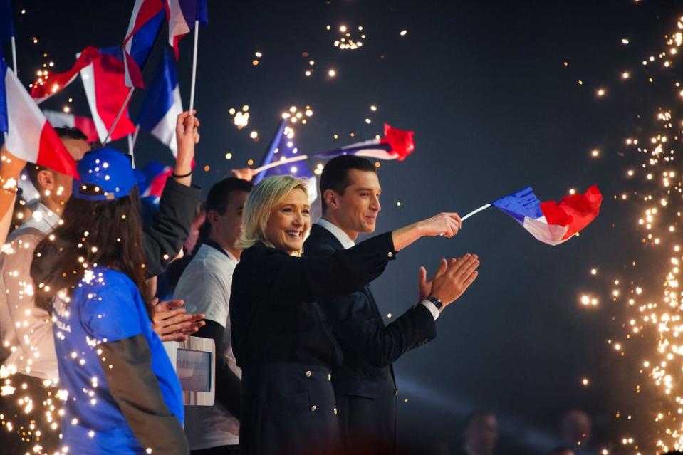 French far-right National Rally party leader Marine Le Pen, centre and president Jordan Bardella salute supporters at a meeting in Marseille, southern France, on March 3, 2024.<span class="copyright">Daniel Cole—AP</span>