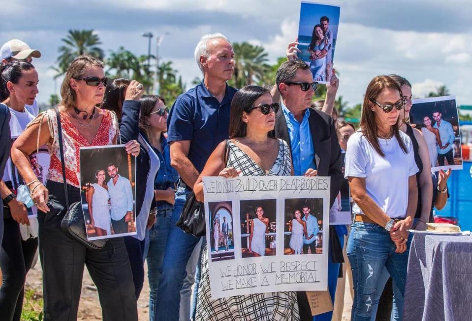Then-Surfside Mayor Charles Burkett (center) joins families of Surfside collapse victims at a news conference on Sept. 23, 2021.