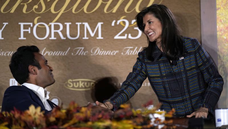 Former United Nations Ambassador Nikki Haley, right, greets businessman Vivek Ramaswamy as the two Republican presidential candidates participate in the Family Leader’s Thanksgiving Family Forum on Friday, Nov. 17, 2023, in Des Moines, Iowa.
