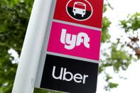 FILE PHOTO: A sign marks a rendezvous location for Lyft and Uber users at San Diego State University in San Diego