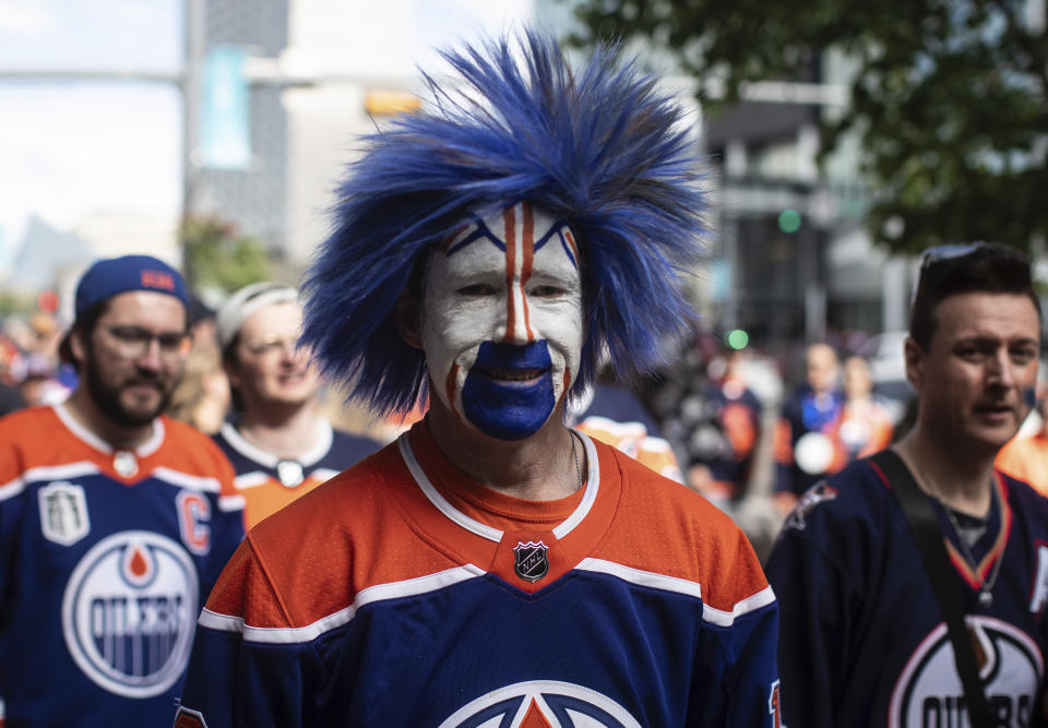 Fans make their way to watch the Florida Panthers take on the Edmonton Oilers in Game 4 of the NHL hockey Stanley Cup Final, Saturday, June 15, 2024, in Edmonton, Alberta. (Jason Franson/The Canadian Press via AP)