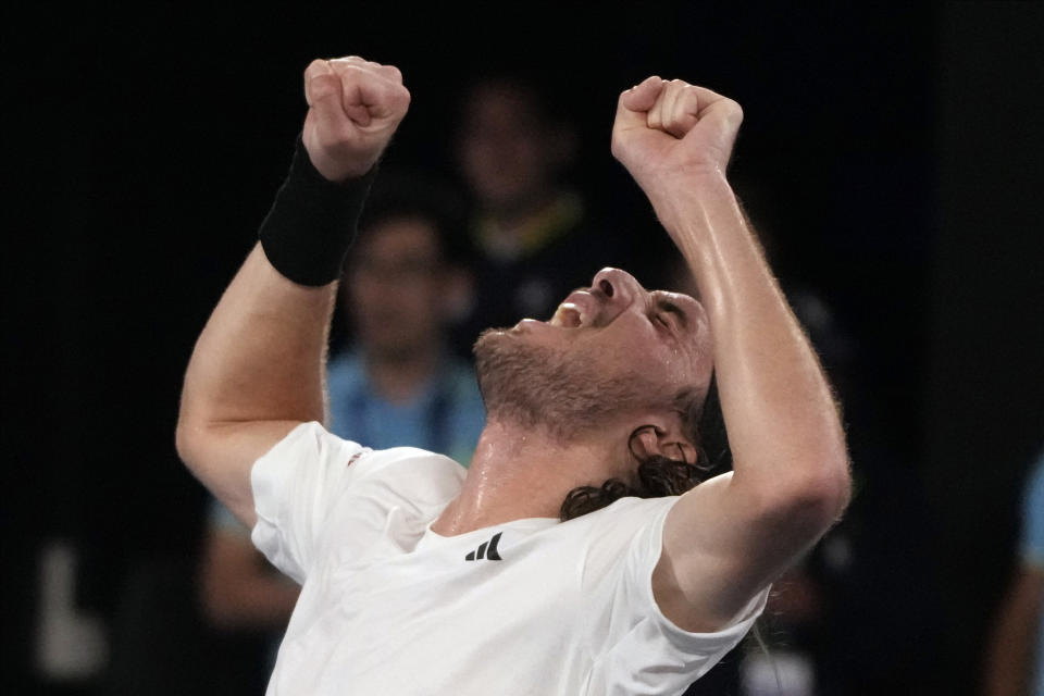 Stefanos Tsitsipas of Greece celebrates after defeating Jannik Sinner of Italy during their fourth round match at the Australian Open tennis championship in Melbourne, Australia, Sunday, Jan. 22, 2023. (AP Photo/Mark Baker)