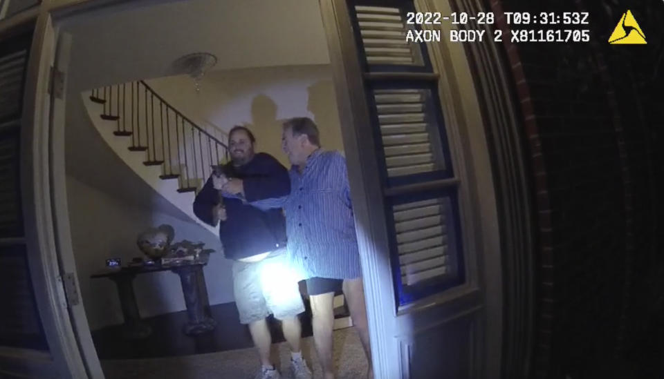 FILE - In this image taken from San Francisco Police Department body-camera video, the husband of former U.S. House Speaker Nancy Pelosi, Paul Pelosi, right, fights for control of a hammer with his assailant David DePape during a brutal attack in the couple's San Francisco home on Oct. 28, 2022. Opening statements are scheduled for Thursday, Nov. 8, 2023, in the federal trial of the man accused of breaking into former House Speaker Nancy Pelosi's San Francisco home seeking to kidnap her and bludgeoning her husband with a hammer. (San Francisco Police Department via AP, File)