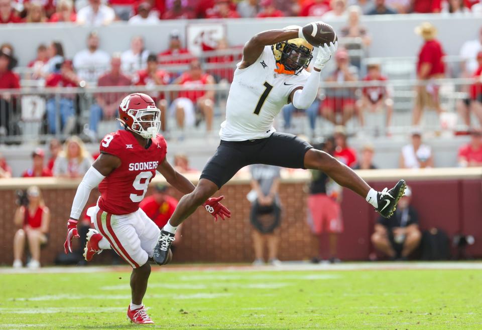 UCF Knights wide receiver Javon Baker (1) makes a catch in front of Oklahoma Sooners defensive back Gentry Williams (9) during the second half Oct. 21, 2023, at Gaylord Family-Oklahoma Memorial Stadium in Norman, Oklahoma.