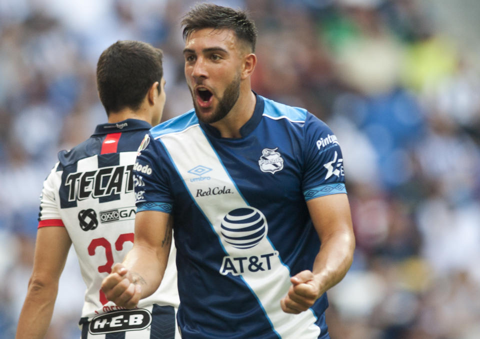 Pueblas Lucas Cavallini celebrates after scoring against Monterrey during a Mexican Apertura 2019 tournament football match at the BBVA Bancomer stadium in Monterrey, Mexico, on September 21, 2019. (Photo by Julio Cesar AGUILAR / AFP)        (Photo credit should read JULIO CESAR AGUILAR/AFP/Getty Images)