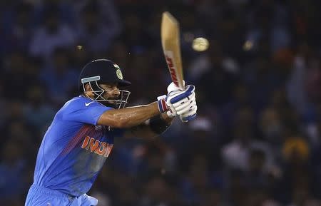 Cricket - India v Australia - World Twenty20 cricket tournament - Mohali, India - 27/03/2016. India's Virat Kohli plays a shot. REUTERS/Adnan Abidi