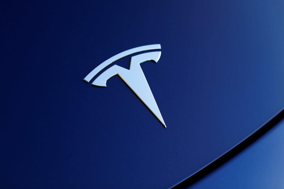The front hood logo on a 2018 Tesla Model 3 electric vehicle is shown in this photo illustration taken in Cardiff, California, U.S., June 1, 2018. Picture taken June 1, 2018.    REUTERS/Mike Blake - RC1581680590