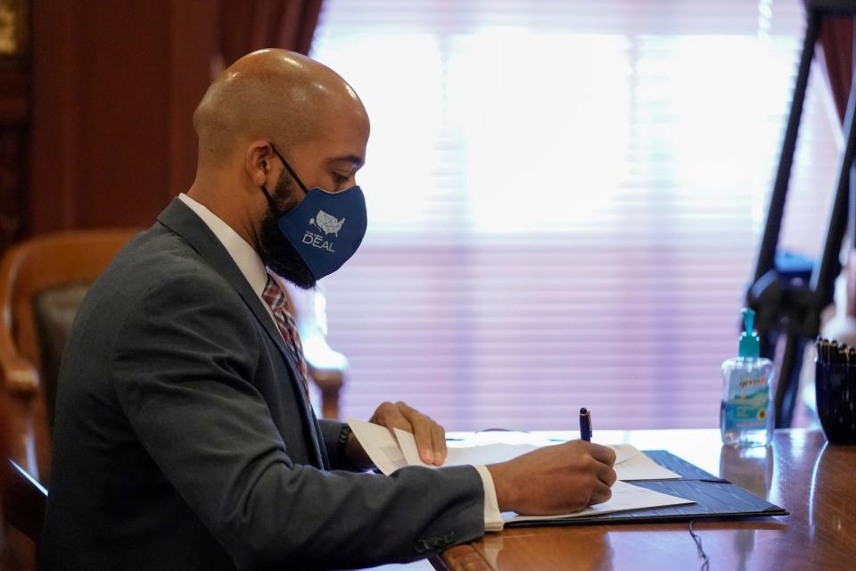 Wisconsin Lt. Gov. Mandela Barnes, a member of Wisconsin's Electoral College, casts his vote at the state Capitol in Madison, Wis., Monday, Dec. 14, 2020. (AP Photo/Morry Gash, Pool)